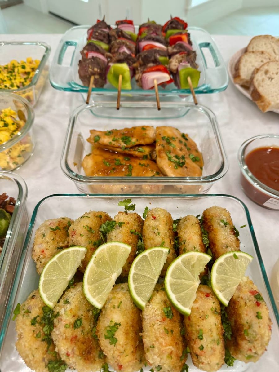 Sticky honey garlic glaze pools under the chicken breasts, parsley chopped fine across the top.