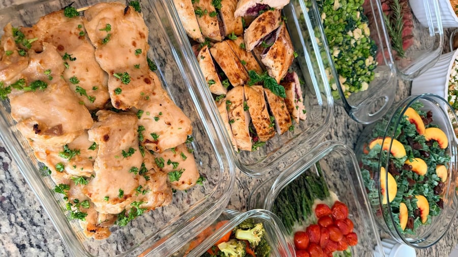 Roasted cherry tomatoes stripe the melted mozzarella over asparagus spears, peas and kale nearby.