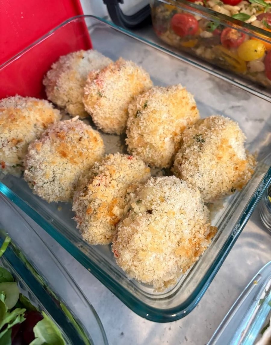 Scallion rings cover the korean ground beef, chicken patties and panko shrimp cakes ranged around it.