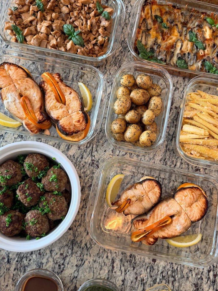 Ten dishes across granite, salmon steaks and dill baby potatoes through the middle band.
