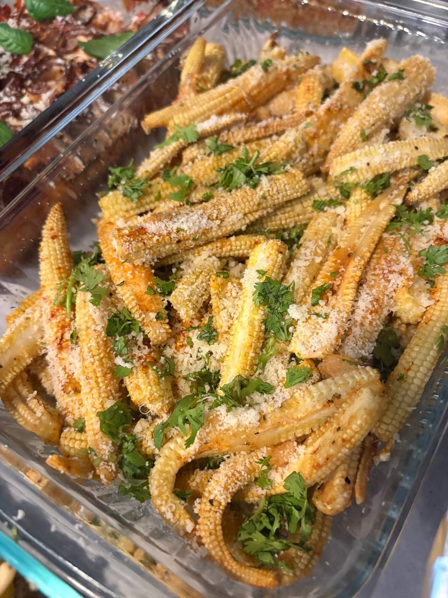 Eggplant sliced thin, rolled, and baked under tomato and Parmesan with whole basil leaves.