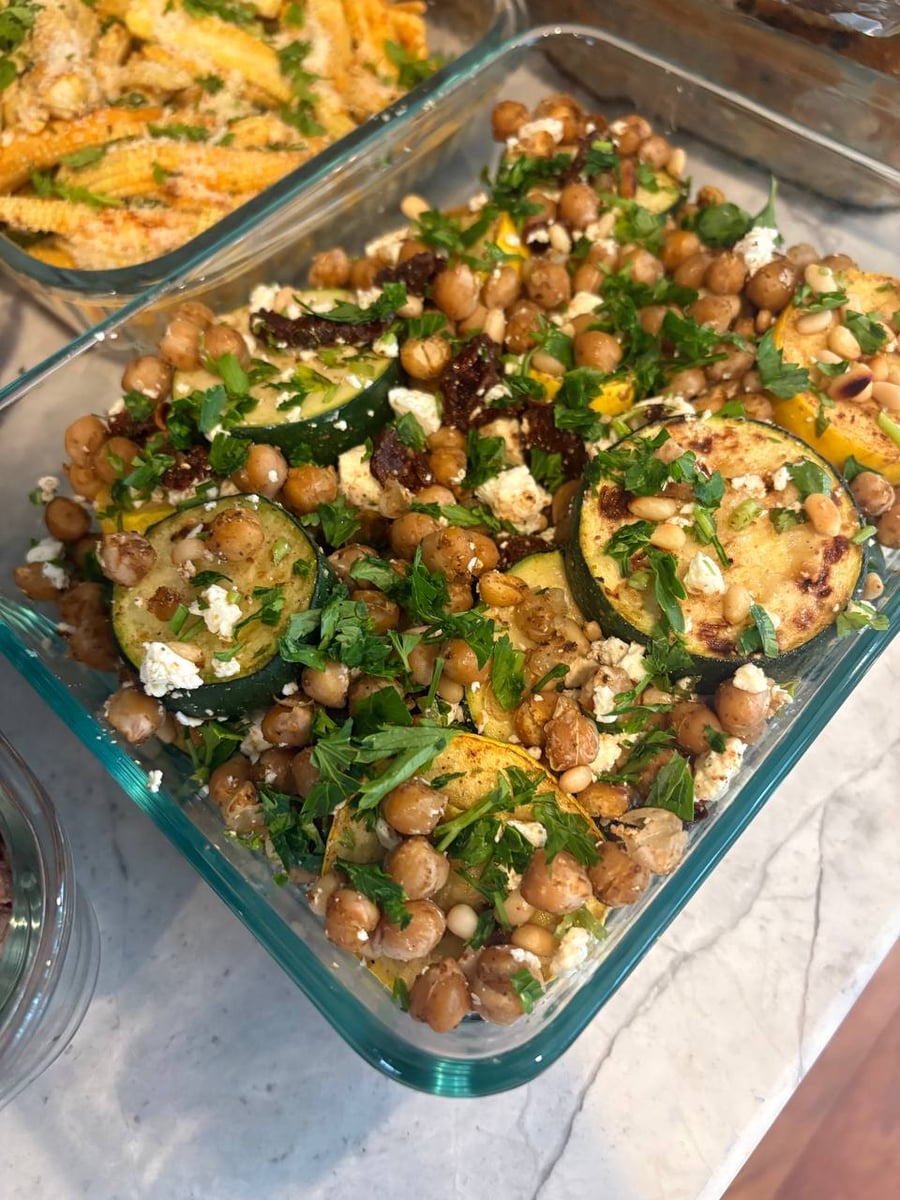 Thai basil chicken bites glossed in their own reduced sauce, fresh basil torn over the top.