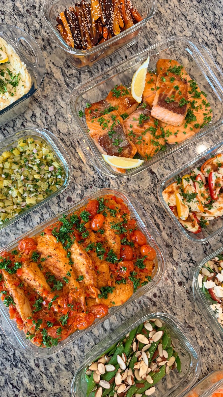 Tuscan chicken among burst cherry tomatoes, with snap peas and toasted almonds below.