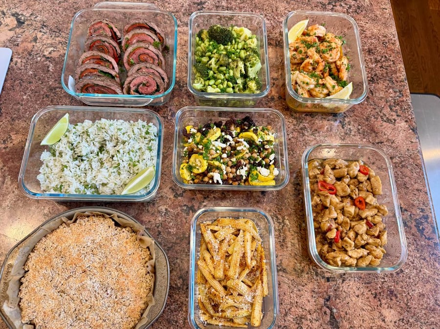 Oat peach crumble in its tin anchors a table of pinwheels, shrimp, rice and thai basil chicken.