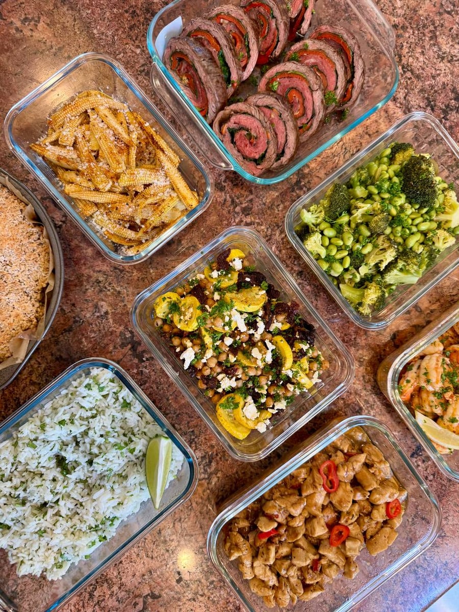 Parmesan-dusted baby corn sits left of steak pinwheels, thai basil chicken and cilantro rice below.