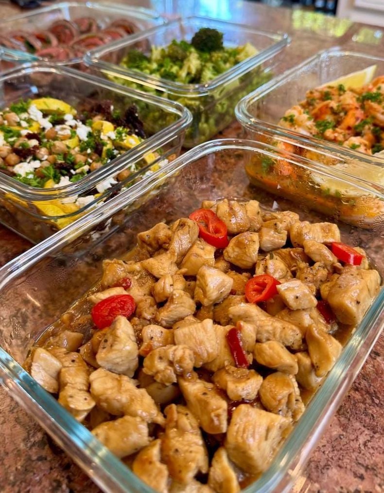 Red chili rings punctuate glossy thai basil chicken, squash and chickpea salad just behind it.