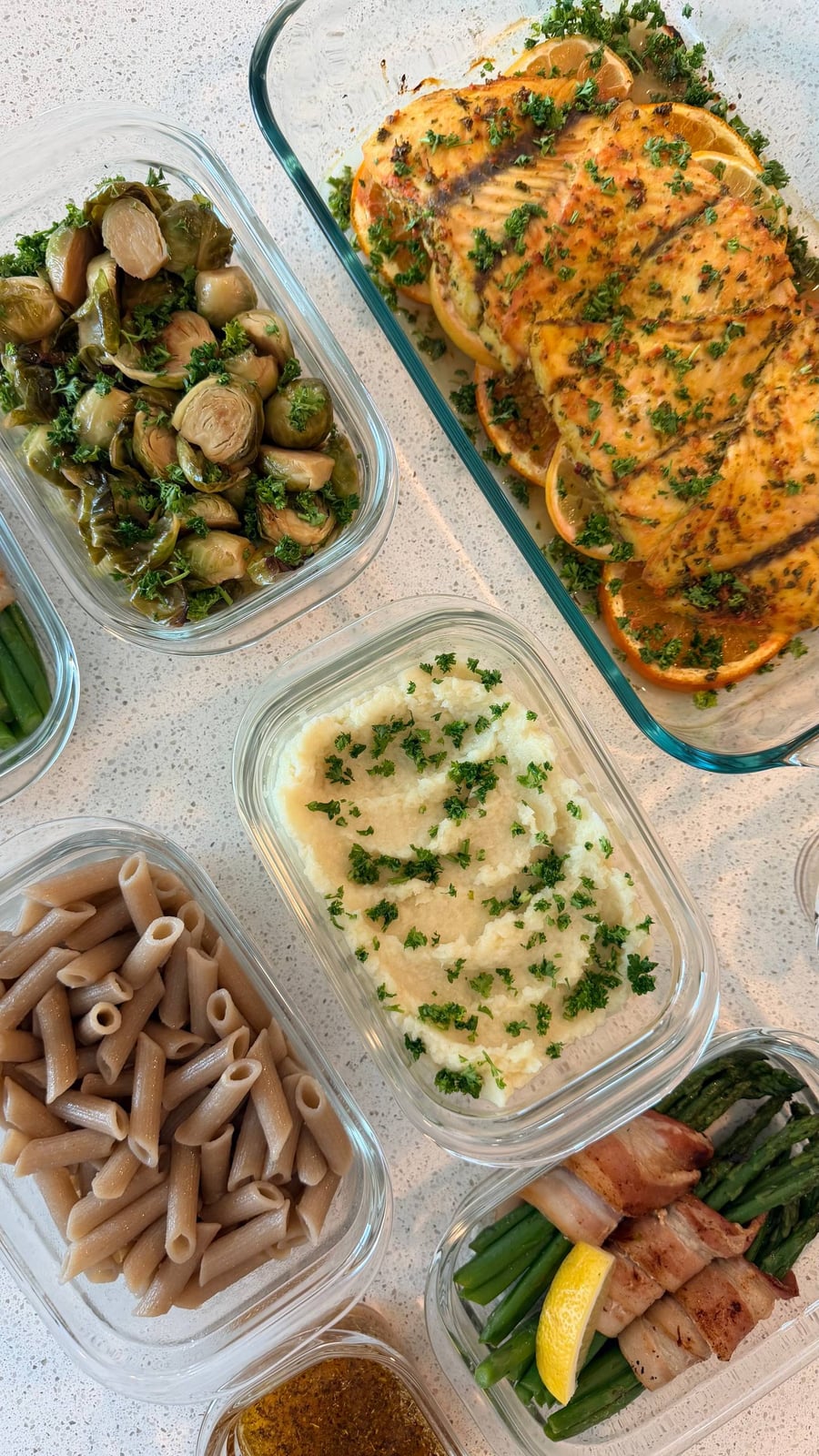 Parsnip puree flecked with parsley sits between cassava penne, maple brussels sprouts and bacon wrapped asparagus.