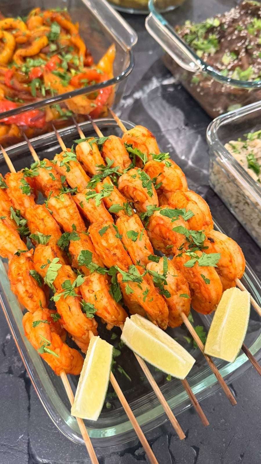 Paprika lime shrimp skewers anchor one corner of the counter, saffron chicken and Chinese beef filling the rest.