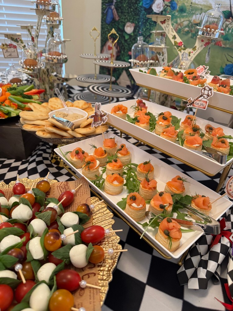 Smoked salmon puff pastry tarts and tomato mozzarella skewers.