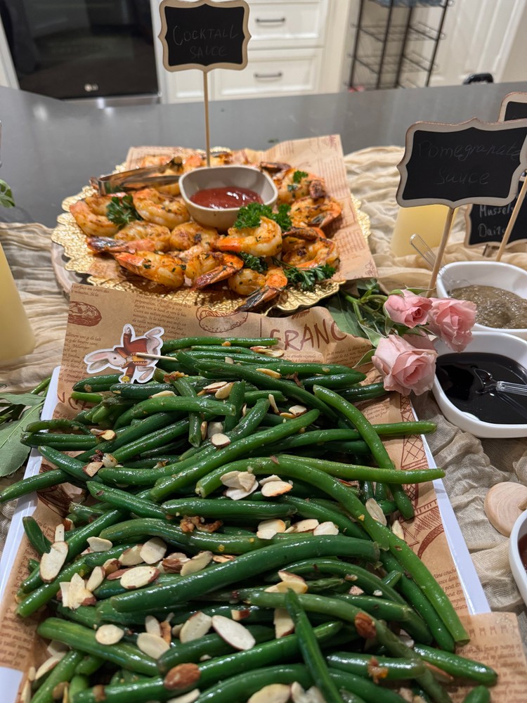 Garlicky green beans and garlic and herb shrimp on a buffet spread