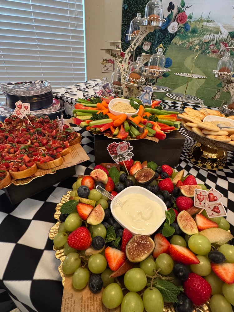 Close-up of fruit platter, veggie platter, and bruschettas.