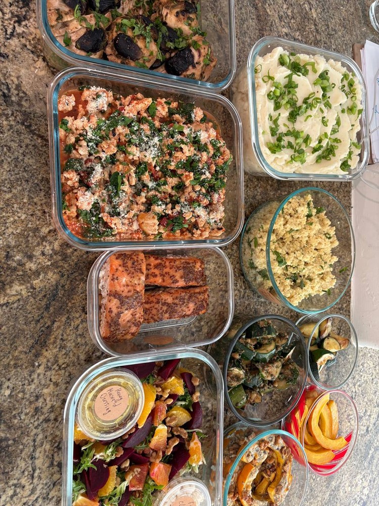 Assortment of meal prep containers with various dishes