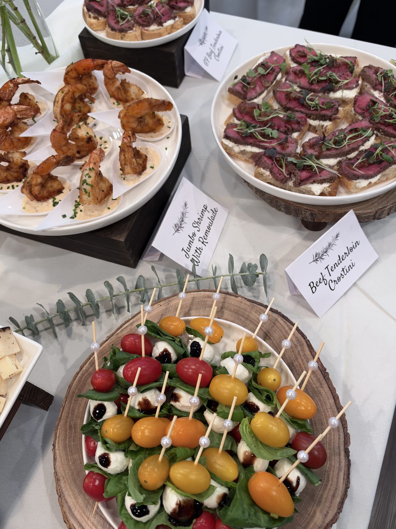 Caprese skewers, shrimp and beef crostini arranged for the birthday dinner.