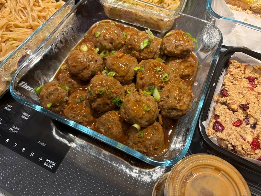 Savory meatballs garnished with green onions.